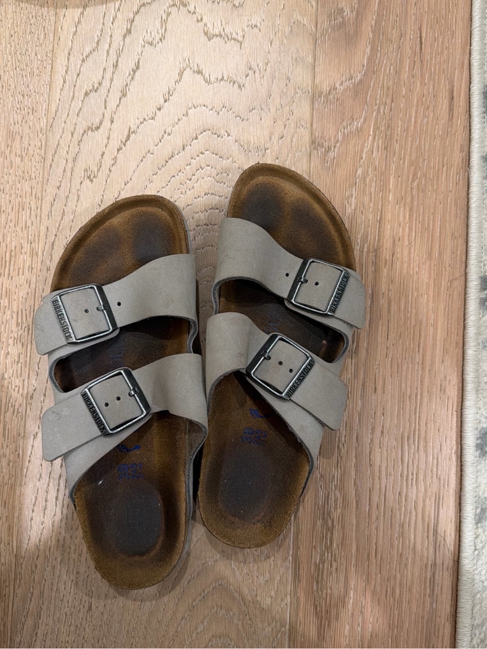 Birkenstock Arizona Sandals in Light Gray with Dark Brown Footbeds